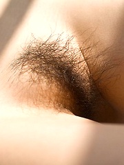 Erotic picture of Kanako Tsuchiya hot Asian teen shows her hairy pussy