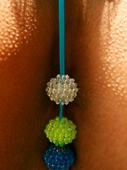 Erotic picture of Naughty Asian model shows her nice tits in her skimpy outfit