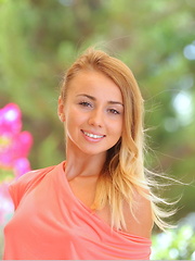 Erotic picture of Linda Chase flaunts her slender, nubile body and smooth pussy on the table.