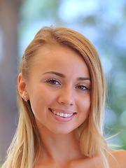 Erotic picture of Linda Chase flaunts her slender, nubile body and smooth pussy on the table.