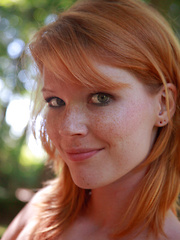 Erotic picture of Stunning redhead Mia Sollis walks in wood, naked and without inhibition
