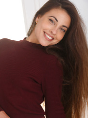 Erotic picture of The gorgeous Lorena B confidently posing as she takes off her crimson sweater and lace panty