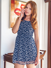 Erotic picture of Dgil shows off her small tits and sweet pussy on the floor.