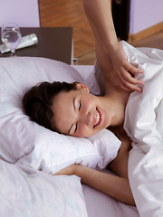 Erotic picture of Iva sensually poses on the bed as she bares her petite body.