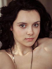 Erotic picture of Anatali shows off her beautiful tits and sweet pussy on the chair.