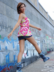 Erotic picture of Suzanna A sensually poses outdoors as she strips her beautiful dress.