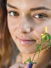Erotic picture of Top model Slava bares her gorgeous body as she strips in the woods.