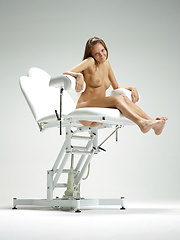 Erotic picture of Cute blonde babe posing on ginecologic chair