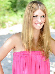 Erotic picture of Admirable teen taking off clothes and posing naked in the shade of the trees near the sea.