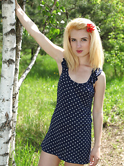 Erotic picture of Beautiful teen blonde honey with perfect body undressing and spreading legs in the woods.