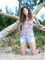 Erotic picture of Gorgeous teen honey stripping and posing in the nude with lucky aborigine on the seaside.