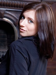 Erotic picture of Simone captures our attention with her sensual, seductive-looking glance, suggesting she\'s in the mood for something romantic and sexual.