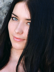 Erotic picture of The way Olivia poses so naturally amongst the grass and rocks in the garden evokes a refreshing ambiance, flaunting her youthful and pretty face, and lustful, delectable body.