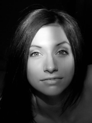 Erotic picture of Straight, silky brown hair, enchanting brown eyes, willowy physique, and smooth, supple body garbed in sexy black lingerie makes Simone a enticing company in bed.