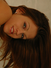 Erotic picture of Top model Eufrat is playful and happy in her red booty shorts or with nothing at all.