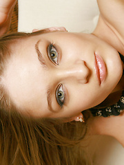 Erotic picture of Playing in long colorful hose and dark eye makeup , this indoor shoot is worth a look.