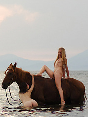 Erotic picture of Two gorgeous models nude going it bareback.