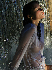 Erotic picture of Super model Jenya is photographed dripping wet in the rain.