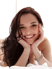 Erotic picture of Smiley teen babe doll shows her perfect boobs