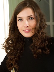 Erotic picture of Semmi sprawls all over the elegant white chair as she strips her black sexy dress and dazzles us with her voluptuous body, puffy large breasts, and her alluring blue eyes.