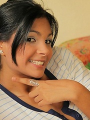 Erotic picture of Karla is wearing her sexy stripes outfit and bears down to just a thong