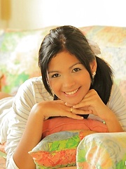 Erotic picture of Karla is wearing her sexy stripes outfit and bears down to just a thong