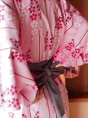 Erotic picture of As Uri lifts up her Japanese Yukata, her silky white panties and wide hips are exposed. The thong is so thin it can't cover the creases of her booty hole.