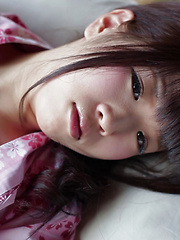 Erotic picture of As Uri lifts up her Japanese Yukata, her silky white panties and wide hips are exposed. The thong is so thin it can't cover the creases of her booty hole.
