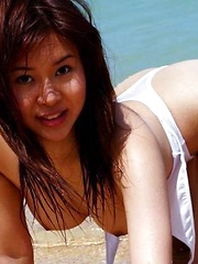 Erotic picture of Azusa Kyouno at the beach posin big round tits