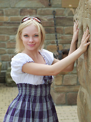 Erotic picture of Feeona A dazzles you with the little school girl look. Outfitted in a blue plaid dress with a little white bodice and no panties she shows off her perfect petite body.