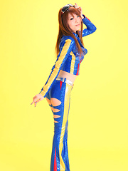 Erotic picture of Minami Haduki Asian plays withlatex suit showing some curves