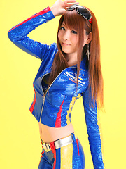 Erotic picture of Minami Haduki Asian plays withlatex suit showing some curves