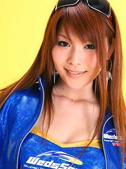 Erotic picture of Minami Haduki Asian plays withlatex suit showing some curves