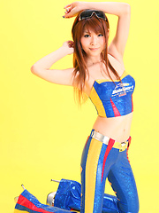 Erotic picture of Minami Haduki Asian plays withlatex suit showing some curves