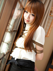 Erotic picture of Dimdim Asian in tight office skirt and blouse is tied in ropes