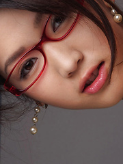 Erotic picture of Noriko Kijima Asian is erotic doctor with red fishnets and specs