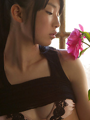 Erotic picture of Tomoe Yamanaka Asian in stockings shows nasty behind at window