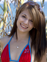 Erotic picture of Sensi takes off her bikini swimwear