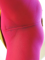 Erotic picture of Trinity wearing pink tights and legwarmers but no panties