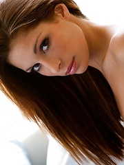 Erotic picture of Cayton Caley - lies in bed against the soft sheets