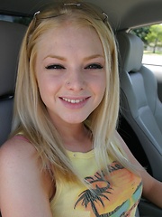 Erotic picture of Blonde teen Skye Model shows off her tight teen body by her friends car