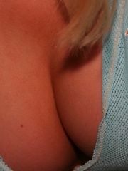 Erotic picture of Cute teen Skye Model shows off her perky tits in a very low cut top