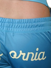 Erotic picture of Petite blonde teen Skye keeps in shape while working out at the gym