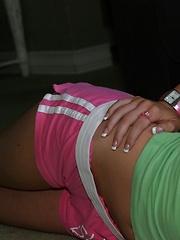 Erotic picture of Skye shows off her tight round ass in tiny shorts