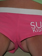 Erotic picture of Skye shows off her tight round ass in tiny shorts