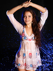 Erotic picture of Norma A pulls off her white dress and gets her body wet