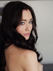 Erotic picture of Piercing blue eyes framed by black elegantly-styled hair, beautiful face matched with a proportionate body, Zsanett Tormay is a real goddess