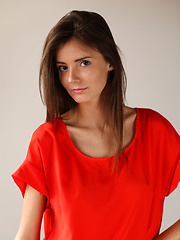 Erotic picture of Sunshine A posing naked in her red hot stiletto heels.