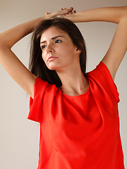 Erotic picture of Sunshine A posing naked in her red hot stiletto heels.