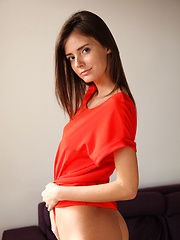 Erotic picture of Sunshine A posing naked in her red hot stiletto heels.